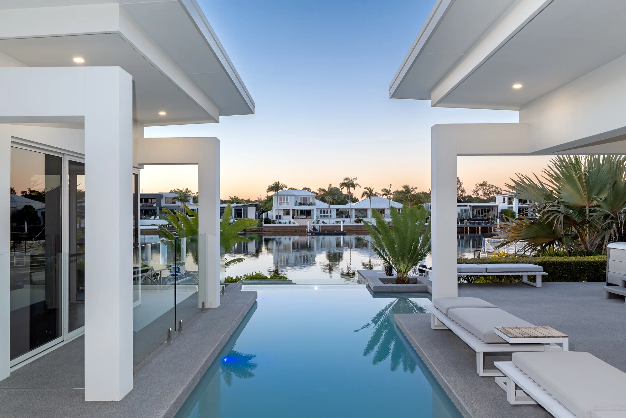 Pool and waterfront at dusk